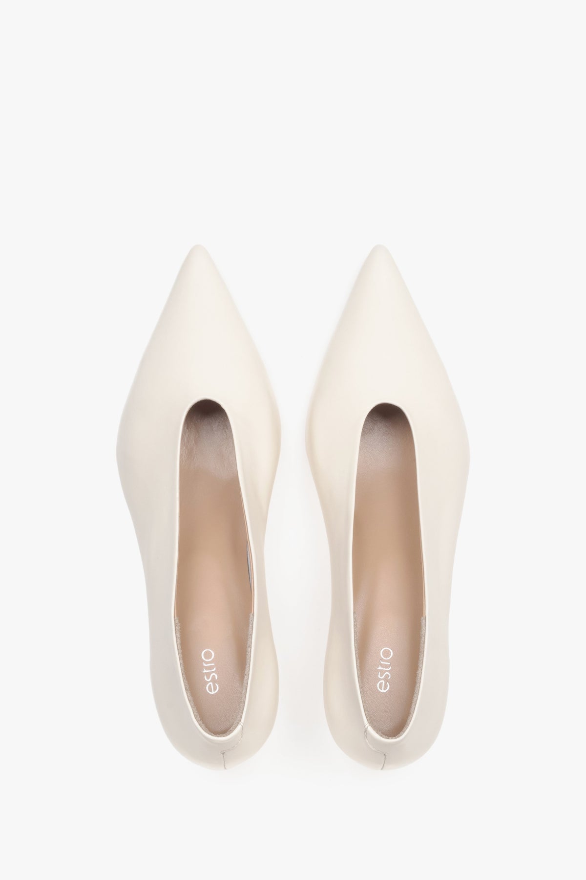 Top view of women’s cream beige leather kitten heels with pointed toe.