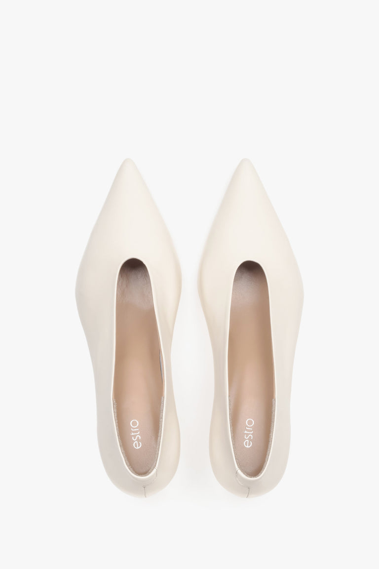 Top view of women’s cream beige leather kitten heels with pointed toe.
