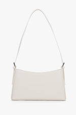 Women's cream beige leather shoulder bag by Estro with slim baguette shape.