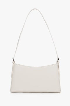 Women's cream beige leather shoulder bag by Estro with slim baguette shape.