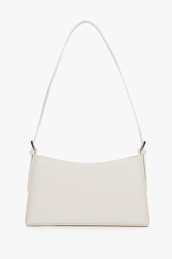 Women's cream beige leather shoulder bag by Estro with slim baguette shape.