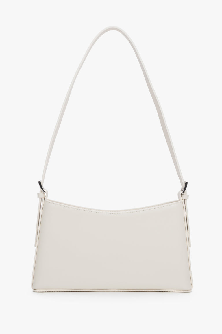 Front view of a cream beige leather shoulder bag with silver-toned hardware.