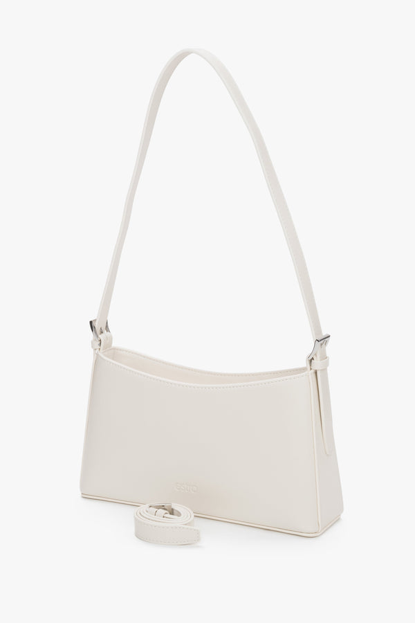 Branded dust bag included with the Estro cream beige leather shoulder bag.