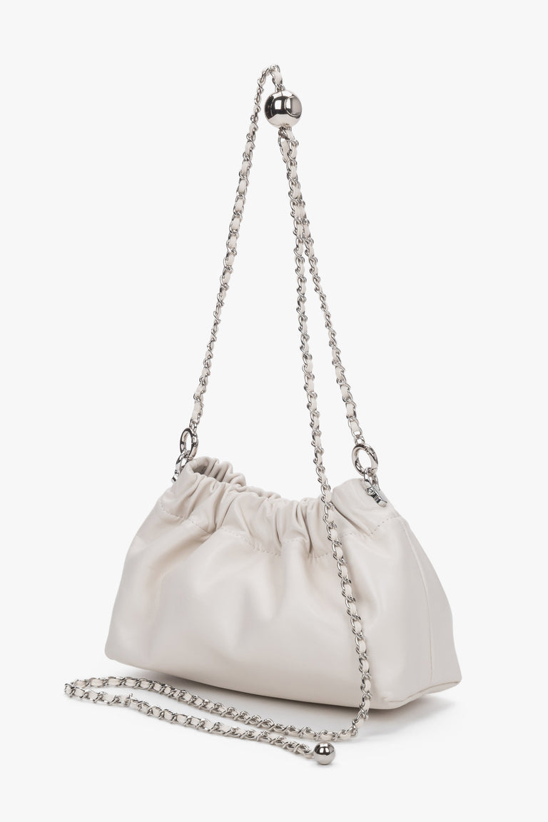 Side view of women's cream beige leather shoulder bag by Estro Selection