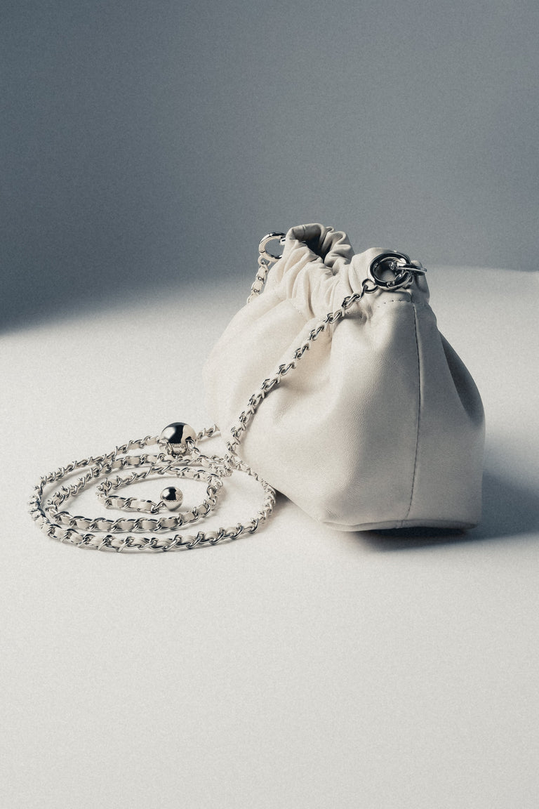 Close-up of cream beige gathered leather shoulder bag by Estro Selection