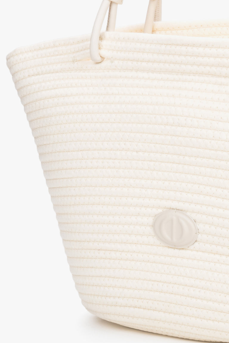 Detail view of cream beige textile shopper bag with straw-like texture
