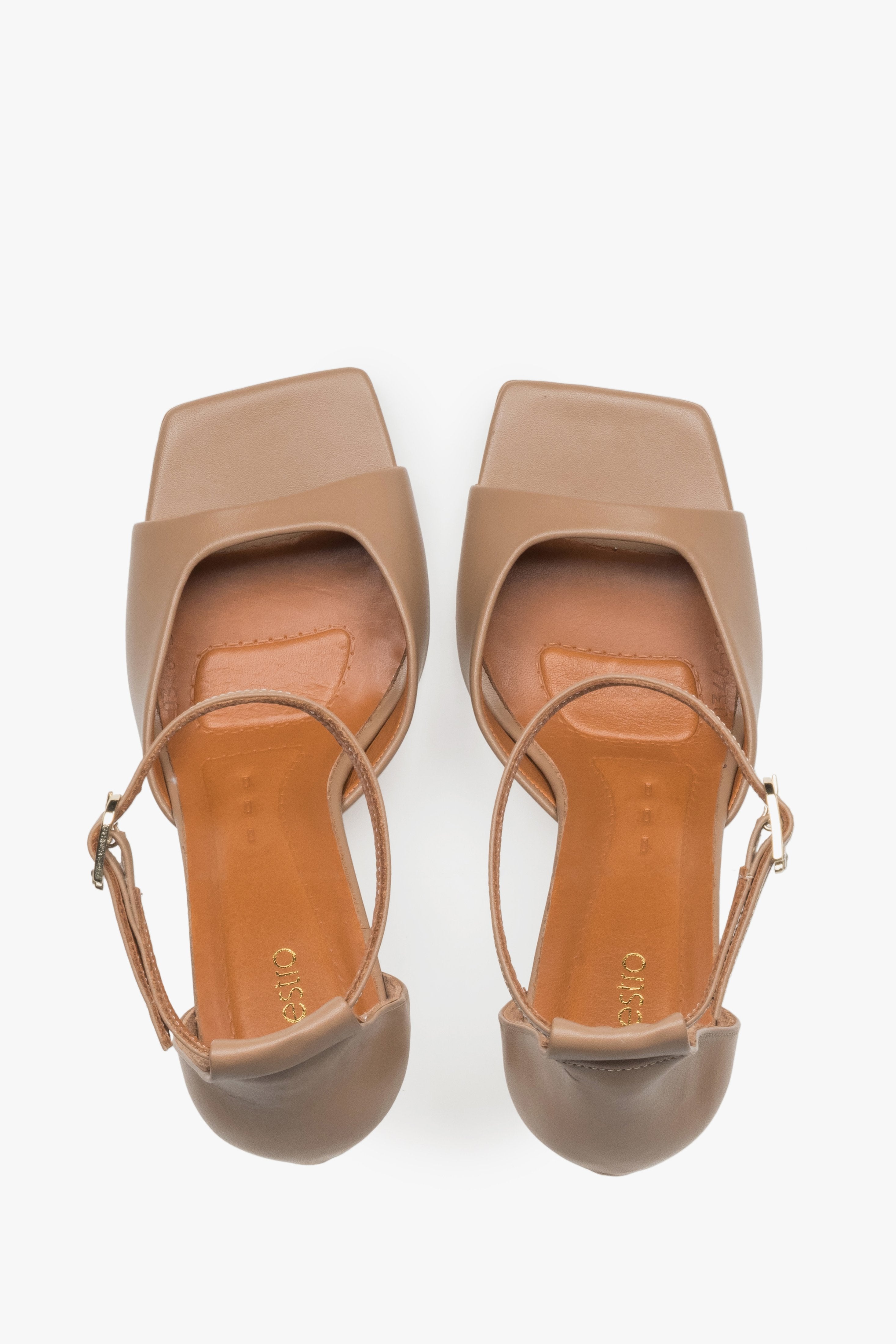 Women’s leather sandals with an open heel, featuring a modern square toe and an arrangement of soft straps.