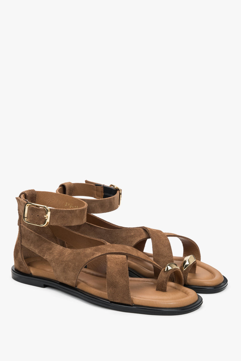 Dark beige women’s velour sandals with a gold toe ring detail.