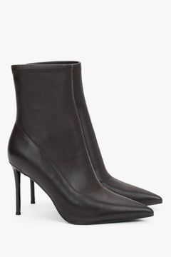 Women’s dark brown ankle boots with an elastic shaft on a high stiletto heel.