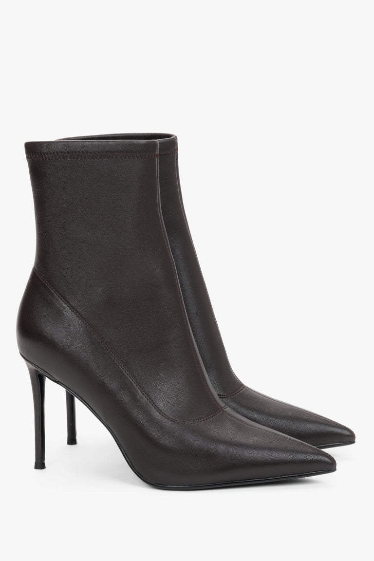 Women’s dark brown ankle boots with an elastic shaft on a high stiletto heel.
