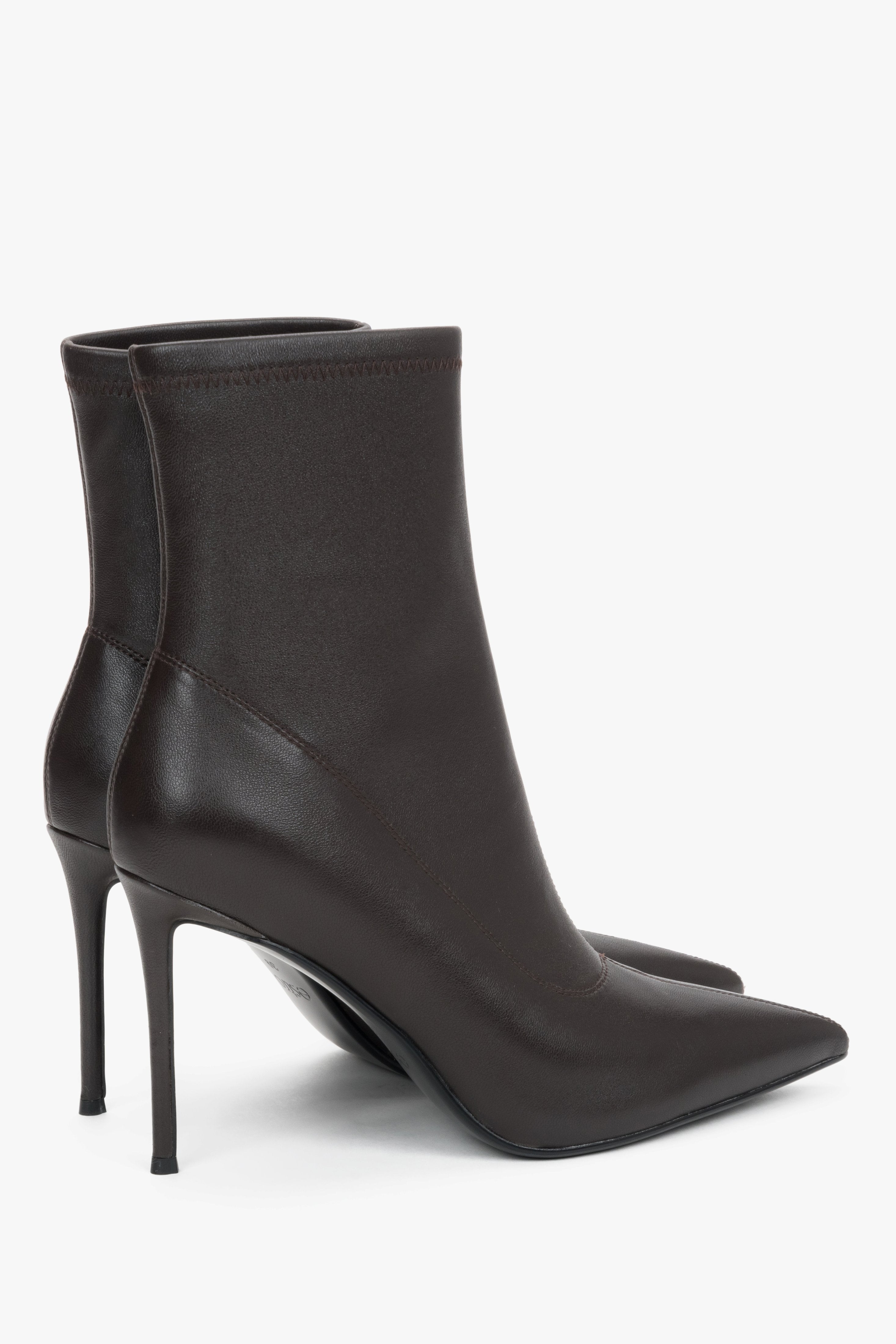 Women’s dark brown ankle boots with an elastic shaft on a high stiletto heel by Estro.