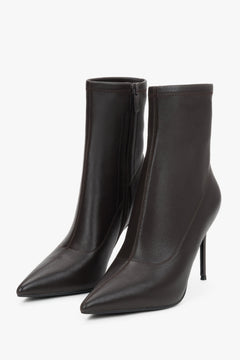 Women’s dark brown ankle boots with an elastic shaft on a high stiletto heel.