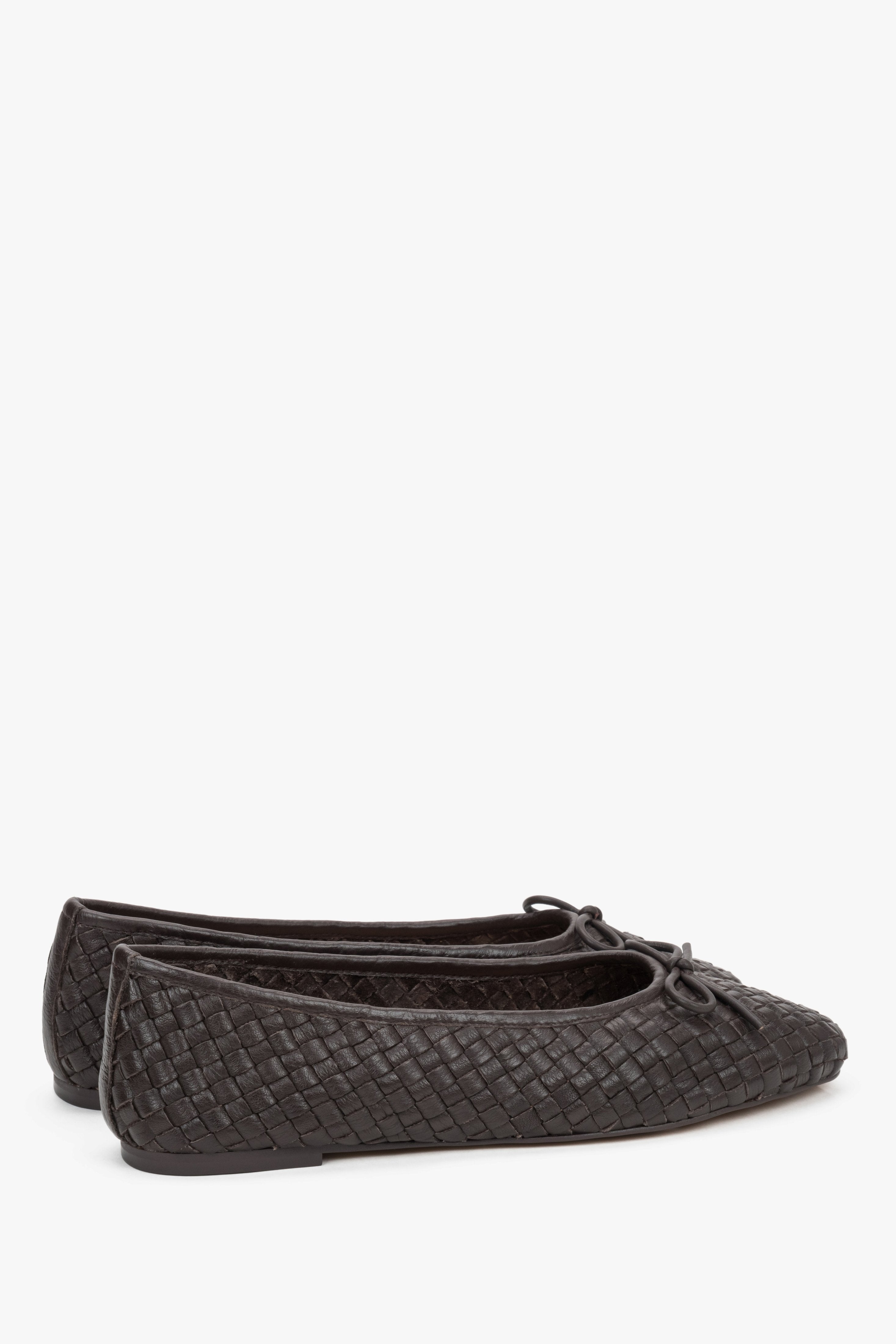 Back view of footwear showing a smooth, structured heel counter that stabilizes the foot and prevents the shoe from slipping off.