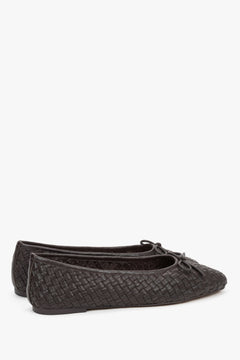 Back view of footwear showing a smooth, structured heel counter that stabilizes the foot and prevents the shoe from slipping off.