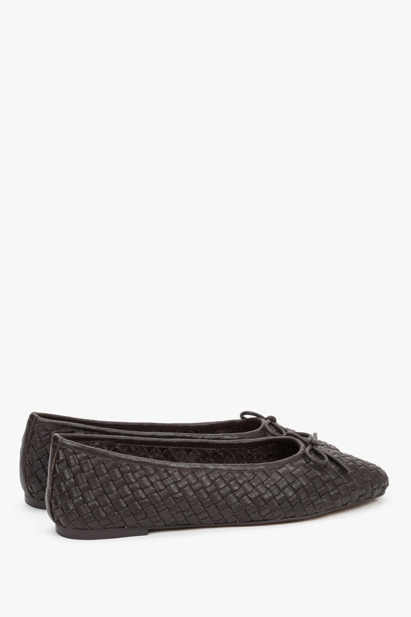 Back view of footwear showing a smooth, structured heel counter that stabilizes the foot and prevents the shoe from slipping off.