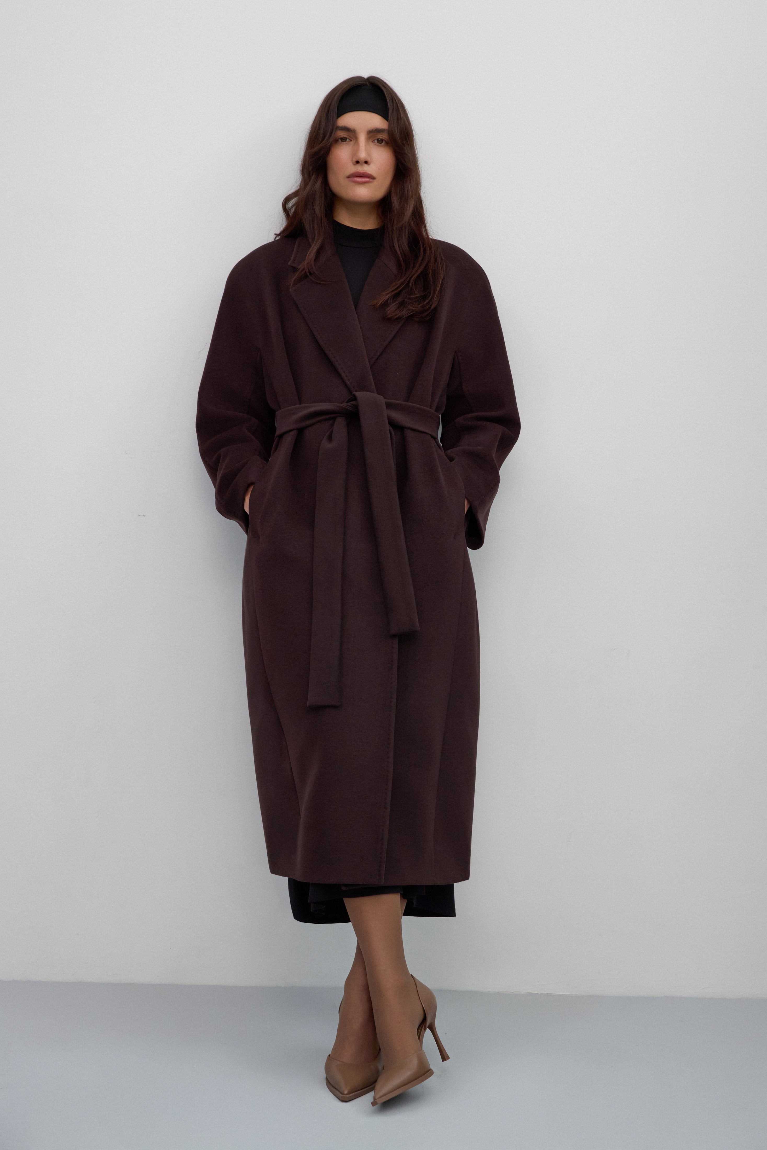 Dark brown bucket coat with wide lapels and a tie waist.