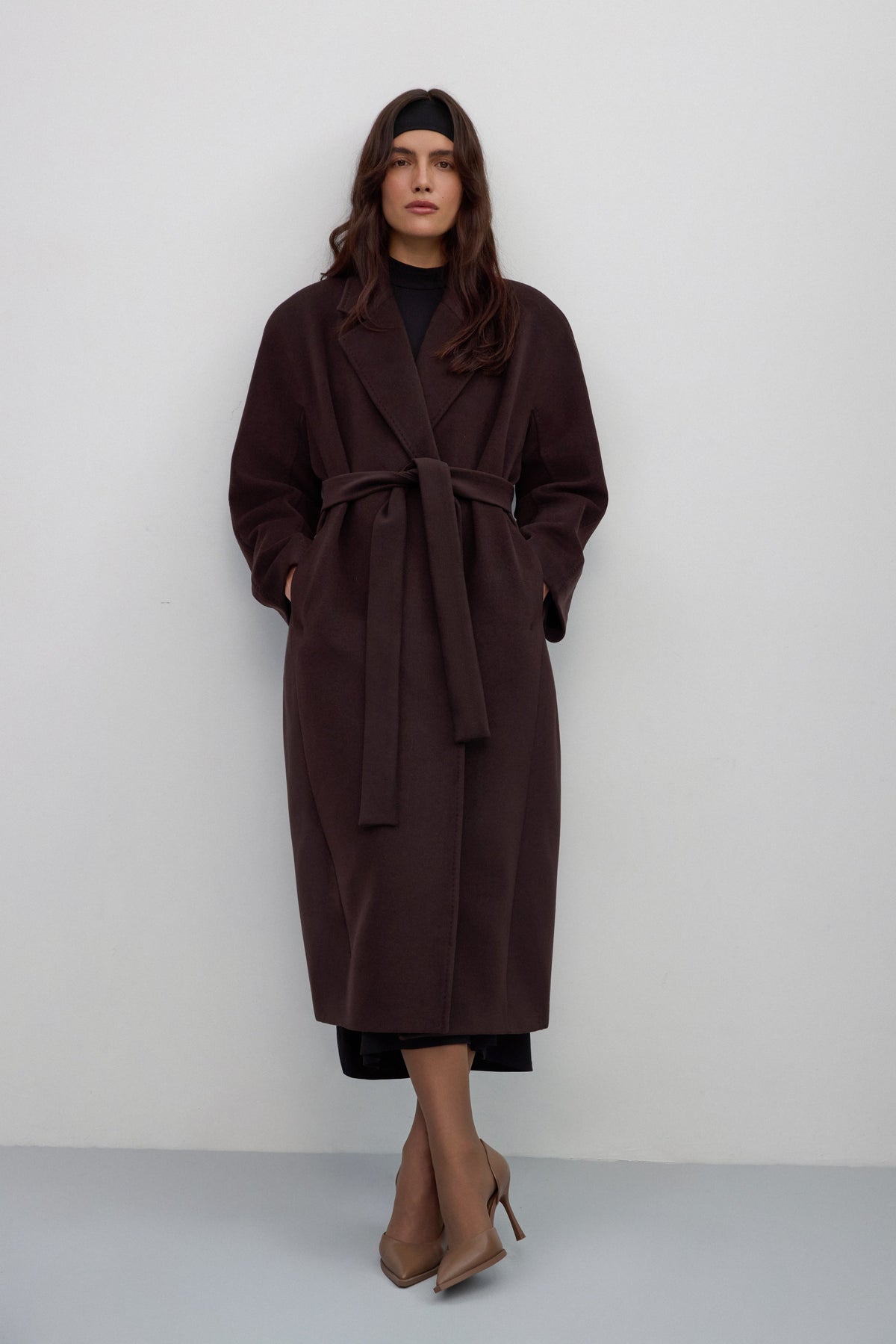Dark brown bucket coat with wide lapels and a tie waist.