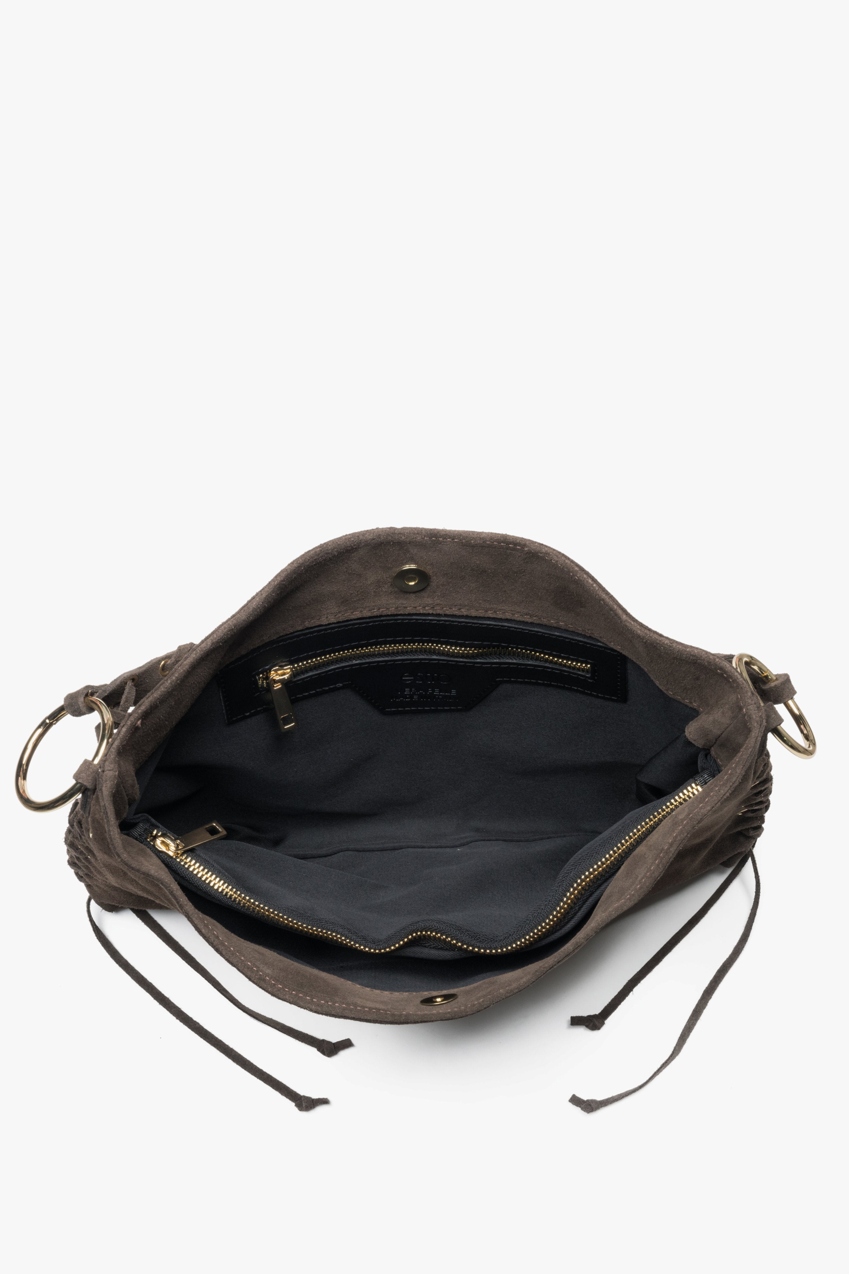 The interior of the bag reveals three roomy compartments and a practical pocket, perfect for keeping essentials neatly organized.