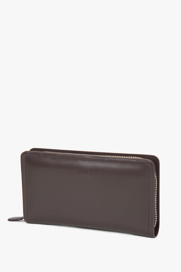 Close-up detail of the genuine leather texture and embossed logo, emphasizing premium quality and craftsmanship.