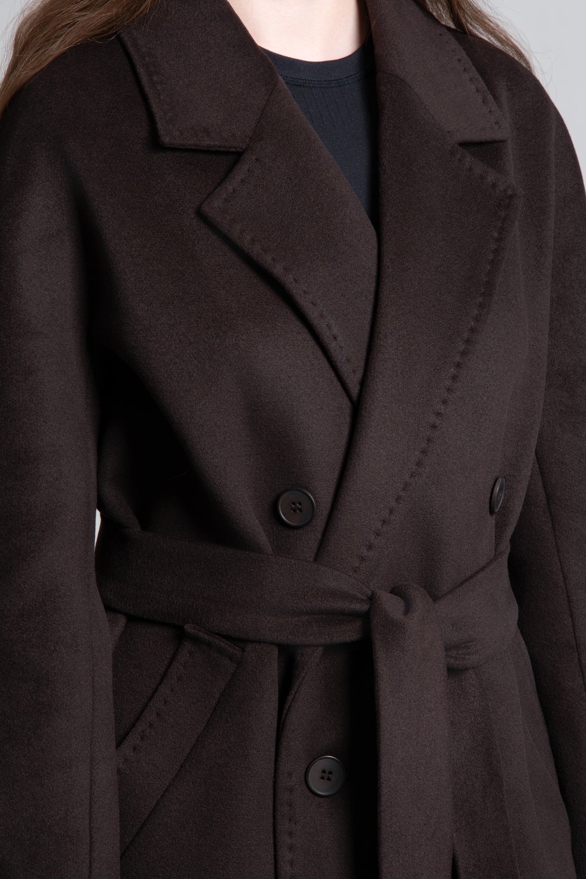 A women's short, double-breasted wool coat in dark brown by Estro.