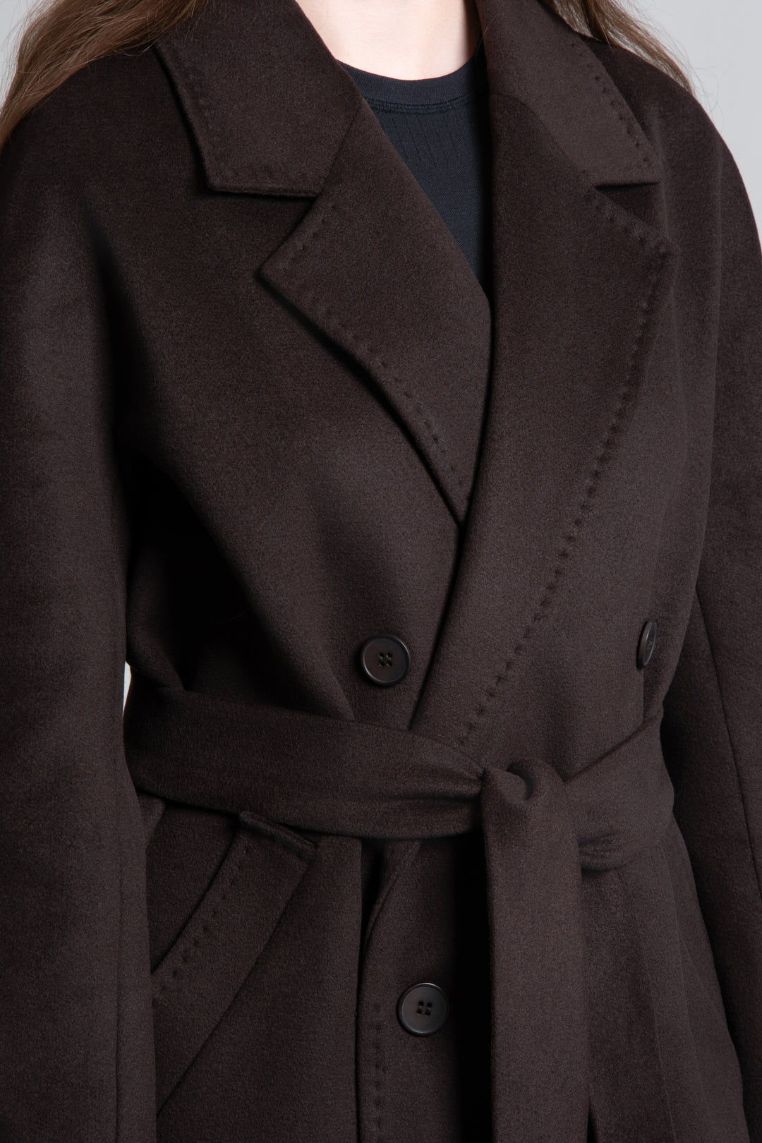 A women's short, double-breasted wool coat in dark brown by Estro.