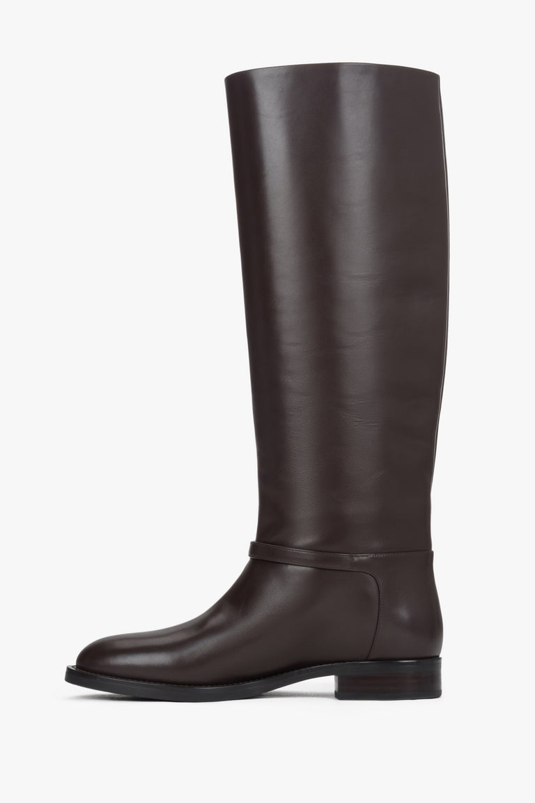 High dark brown women's boots made of genuine leather with a gold buckle.