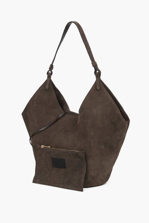 Dark brown hobo bag with comfortable shoulder handle and included small cosmetic pouch, blending elegance and functionality for modern living.
