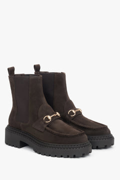 Timeless design meets Italian craftsmanship — dark brown velour Chelsea boots with a golden accent.