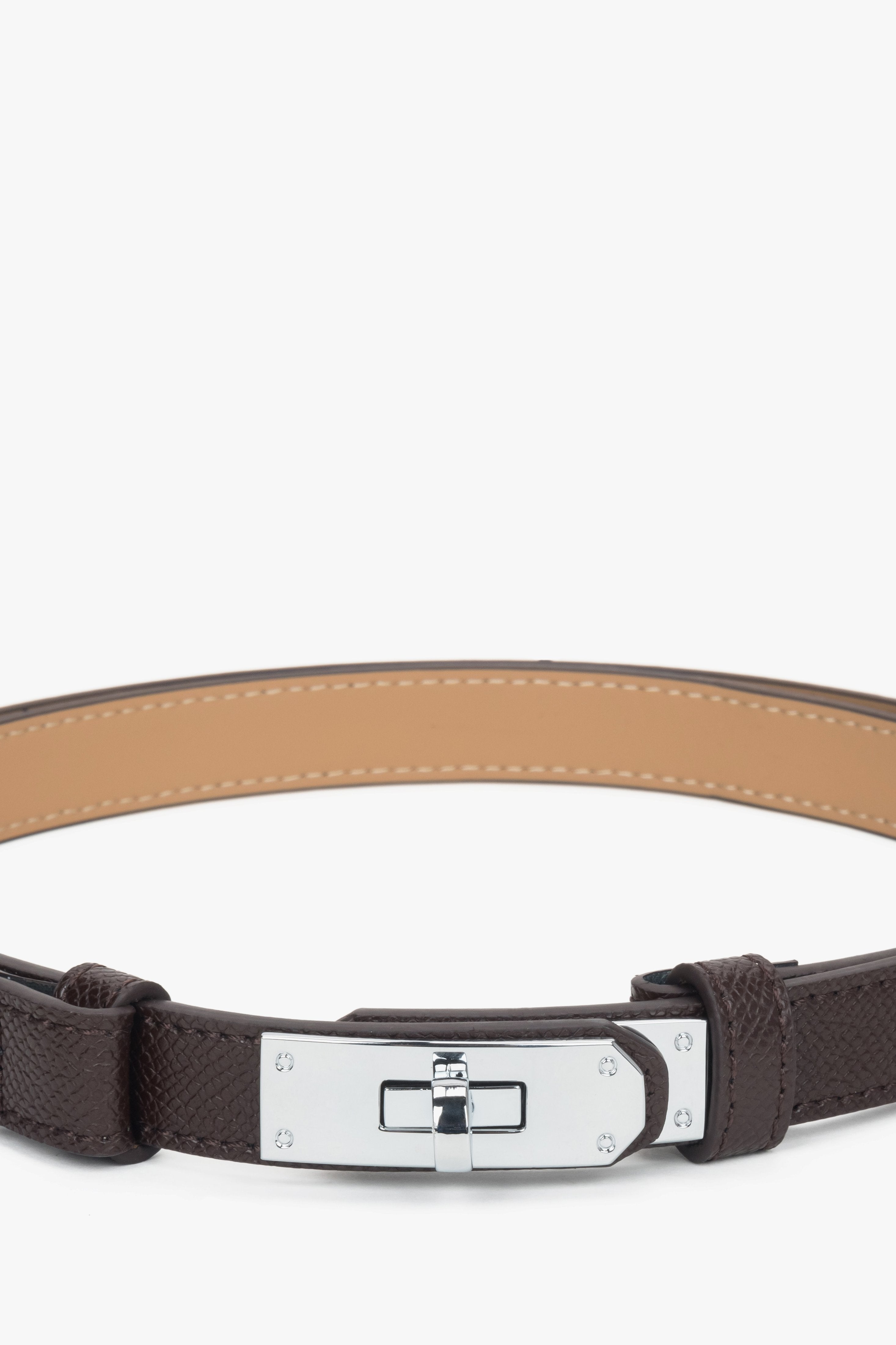 Women's dark brown leather belt with a silver buckle.