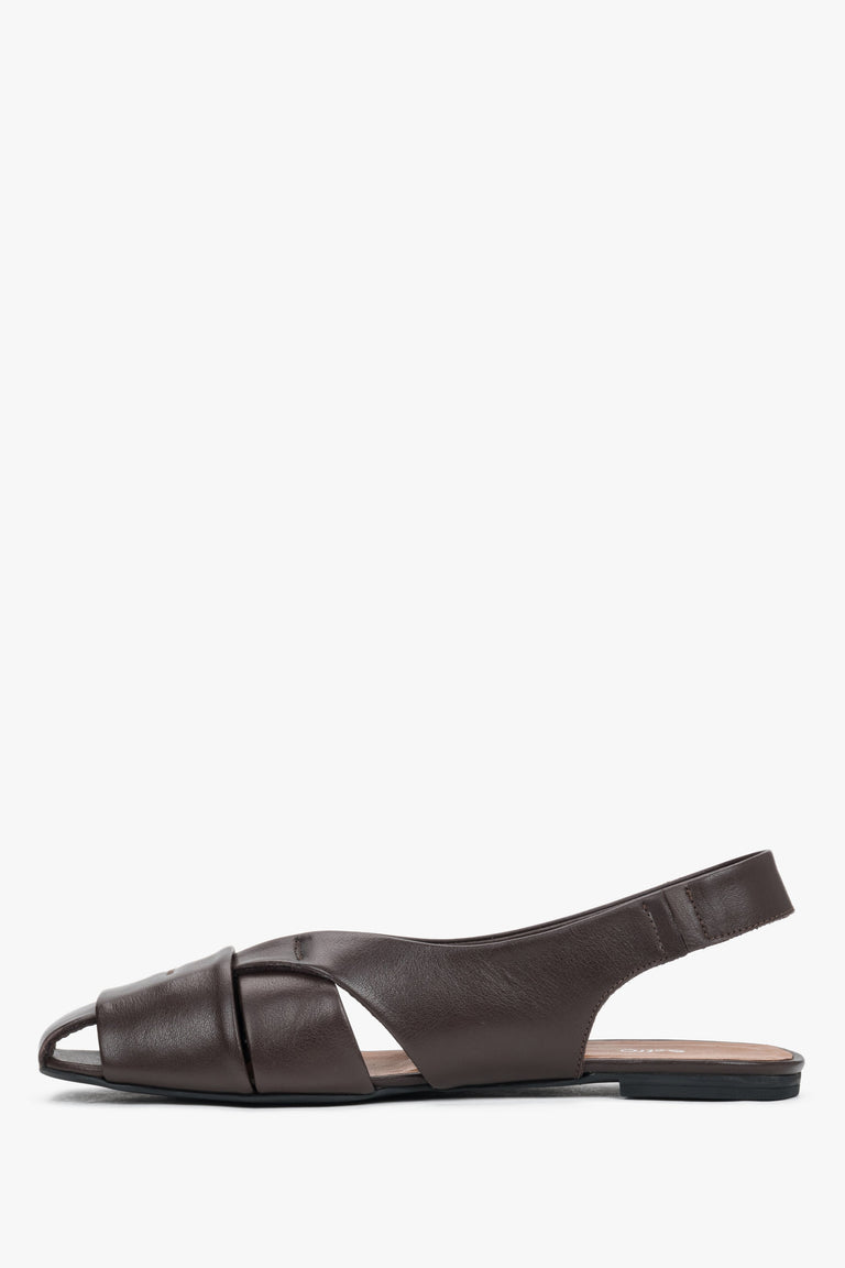Profile of dark brown leather sandals with open heel.