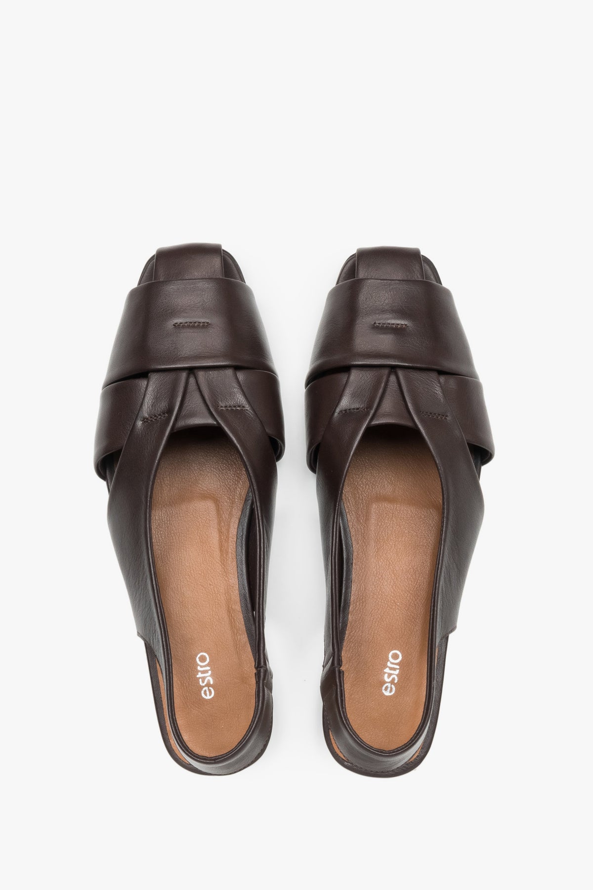 View from above of dark brown leather flat sandals.