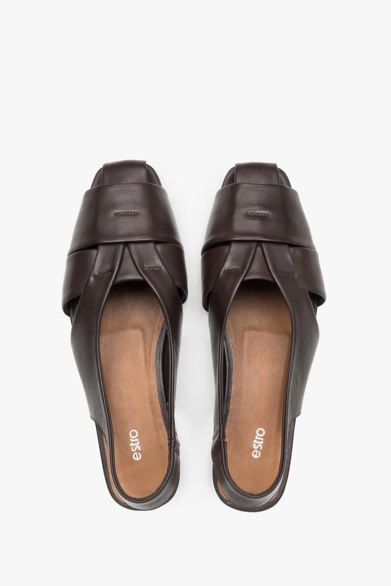 View from above of dark brown leather flat sandals.