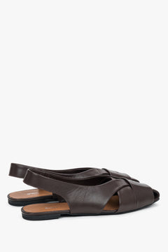 Dark brown closed-toe leather sandals.