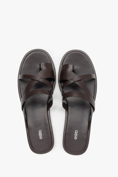 Women's minimalist dark brown leather slide sandals with soft interwoven straps.