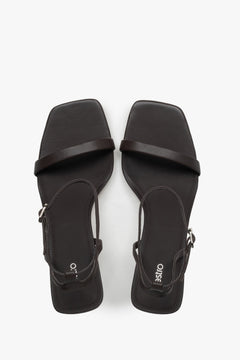Top view of women's dark brown leather sandals by Estro