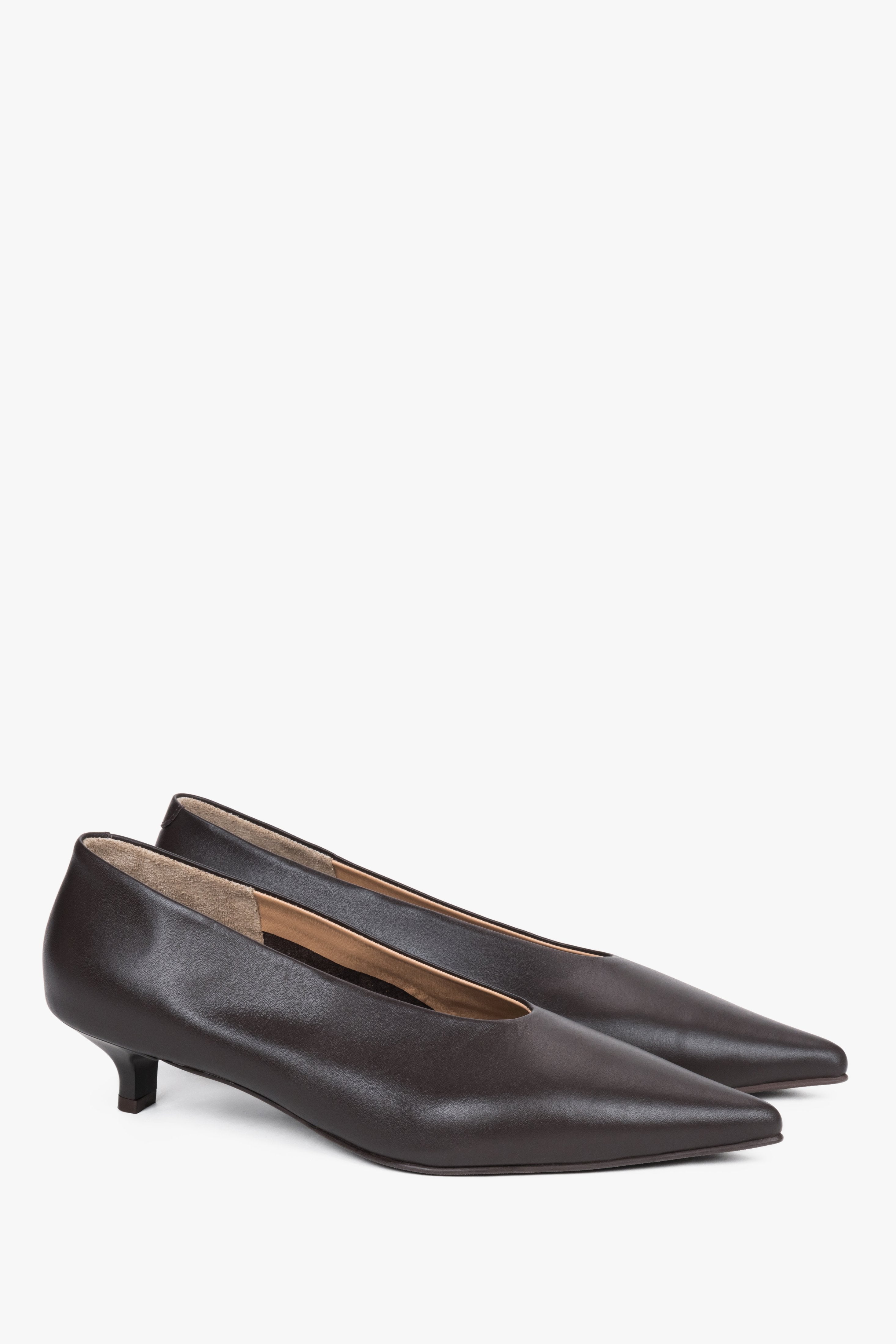 Side view of women’s dark brown leather shoes with low funnel heel.