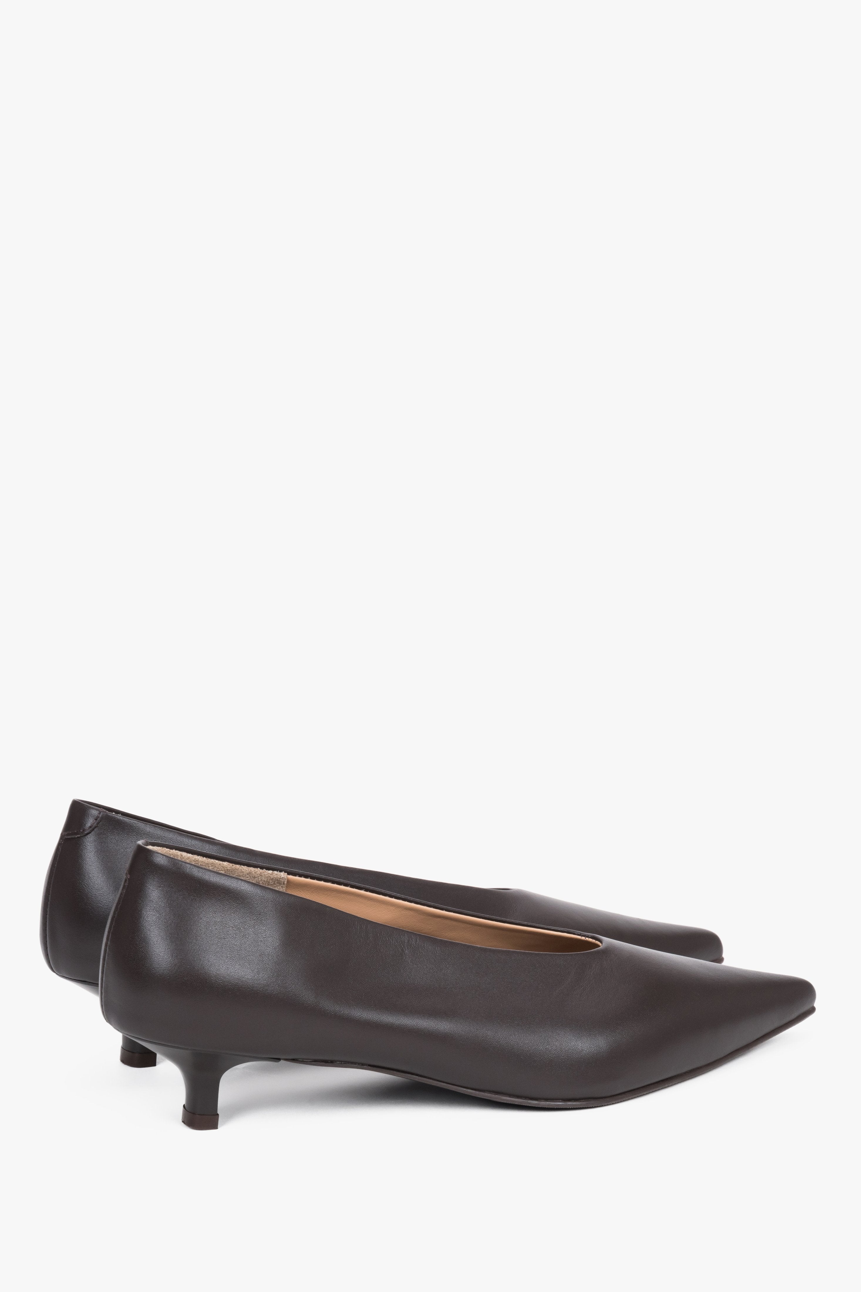 Detail view of the pointed toe and smooth dark brown leather finish.