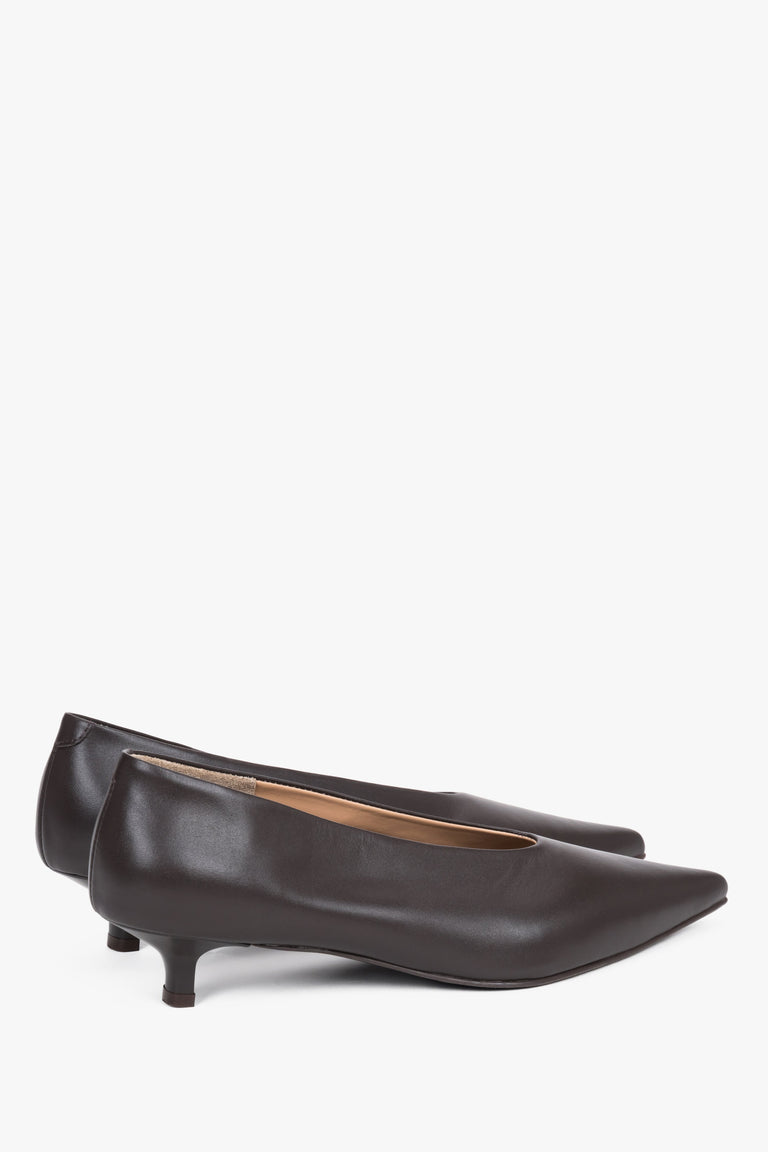 Detail view of the pointed toe and smooth dark brown leather finish.