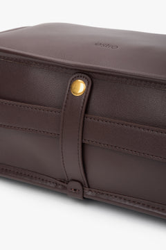 Leather dark brown women’s handbag with a wide strap from Estro.