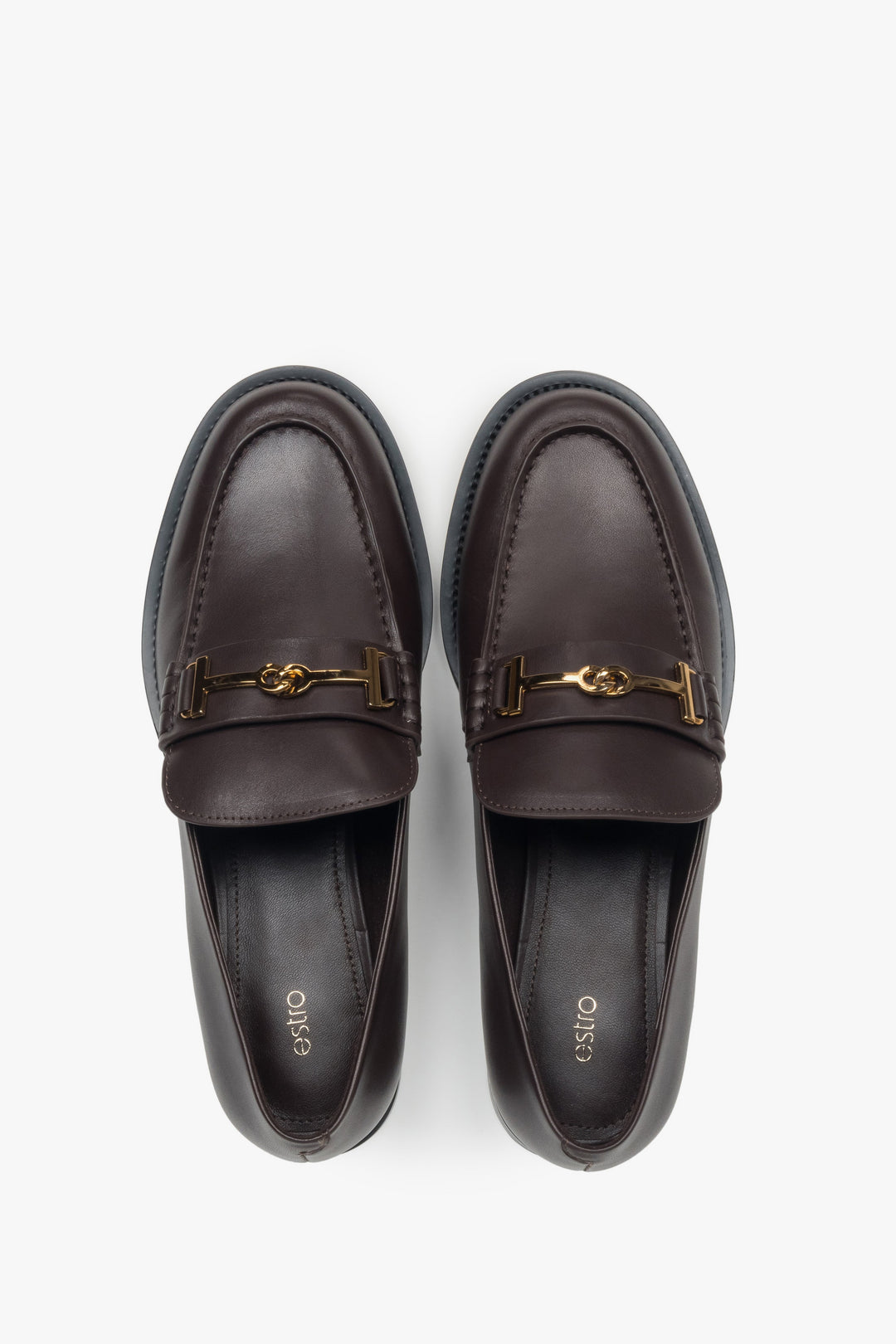 Women’s loafers Estro, dark brown, made of genuine leather, with a decorative buckle.

