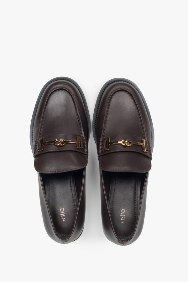 Women’s loafers Estro, dark brown, made of genuine leather, with a decorative buckle.
