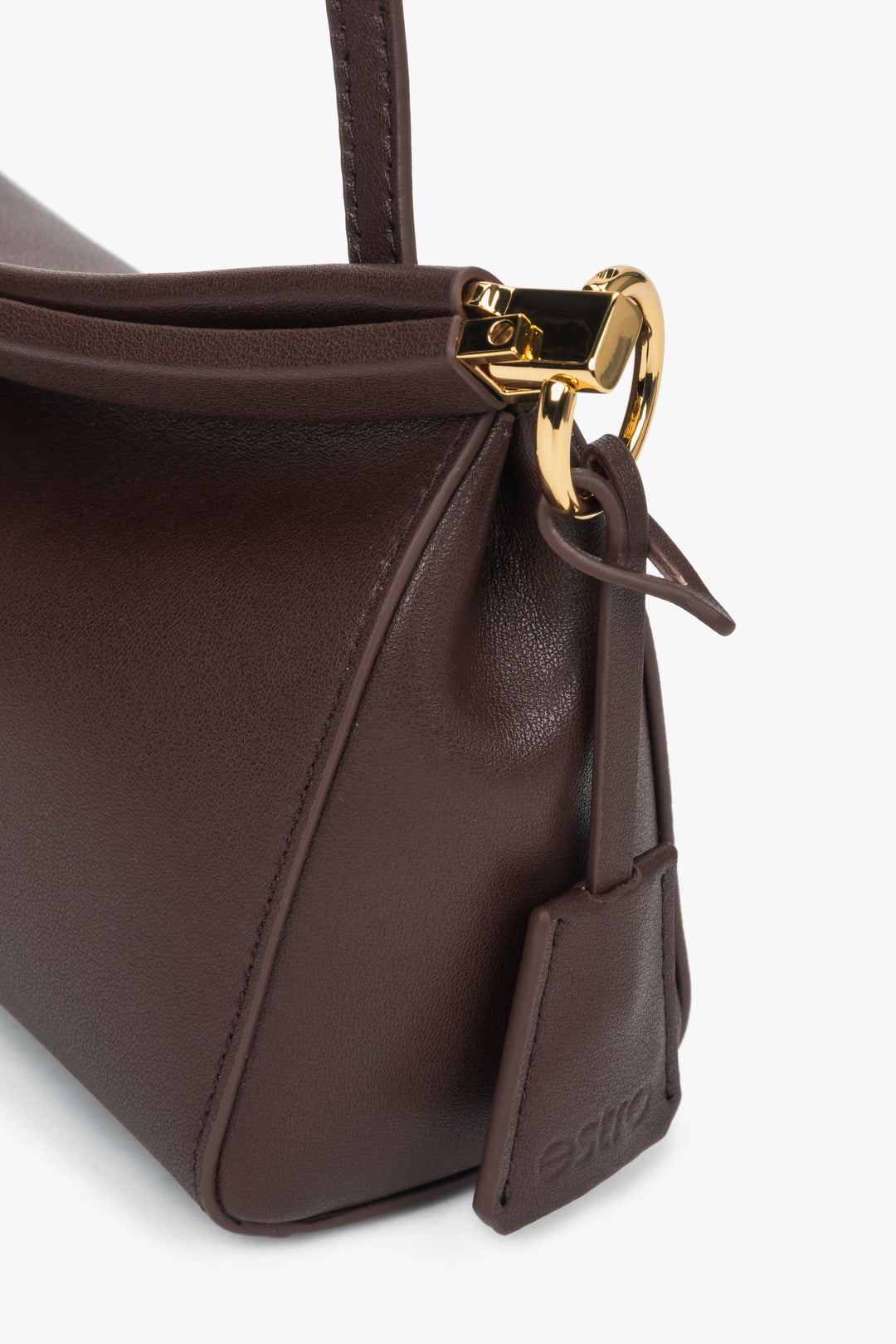 Genuine leather shoulder bag with gold accents, perfect for casual and dressy outfits.