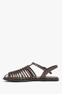 Elegant dark brown genuine leather closed-toe sandals with a flat heel.