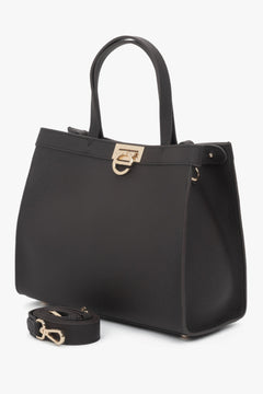 Structured silhouette with a secure buckle closure and logo-finished snap.