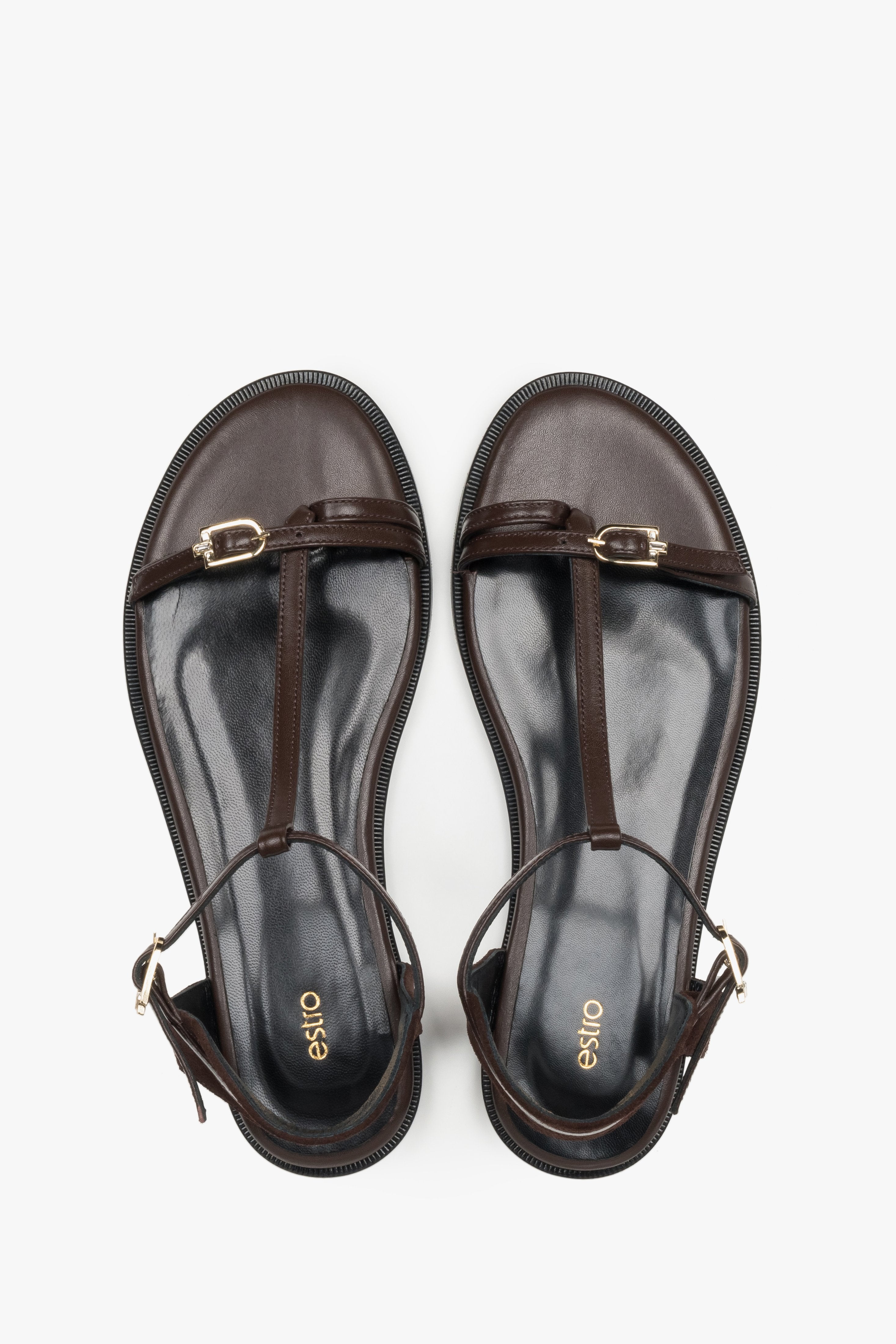 Top view of women's dark brown flat sandals by Estro