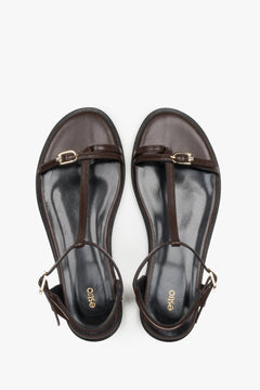 Top view of women's dark brown flat sandals by Estro
