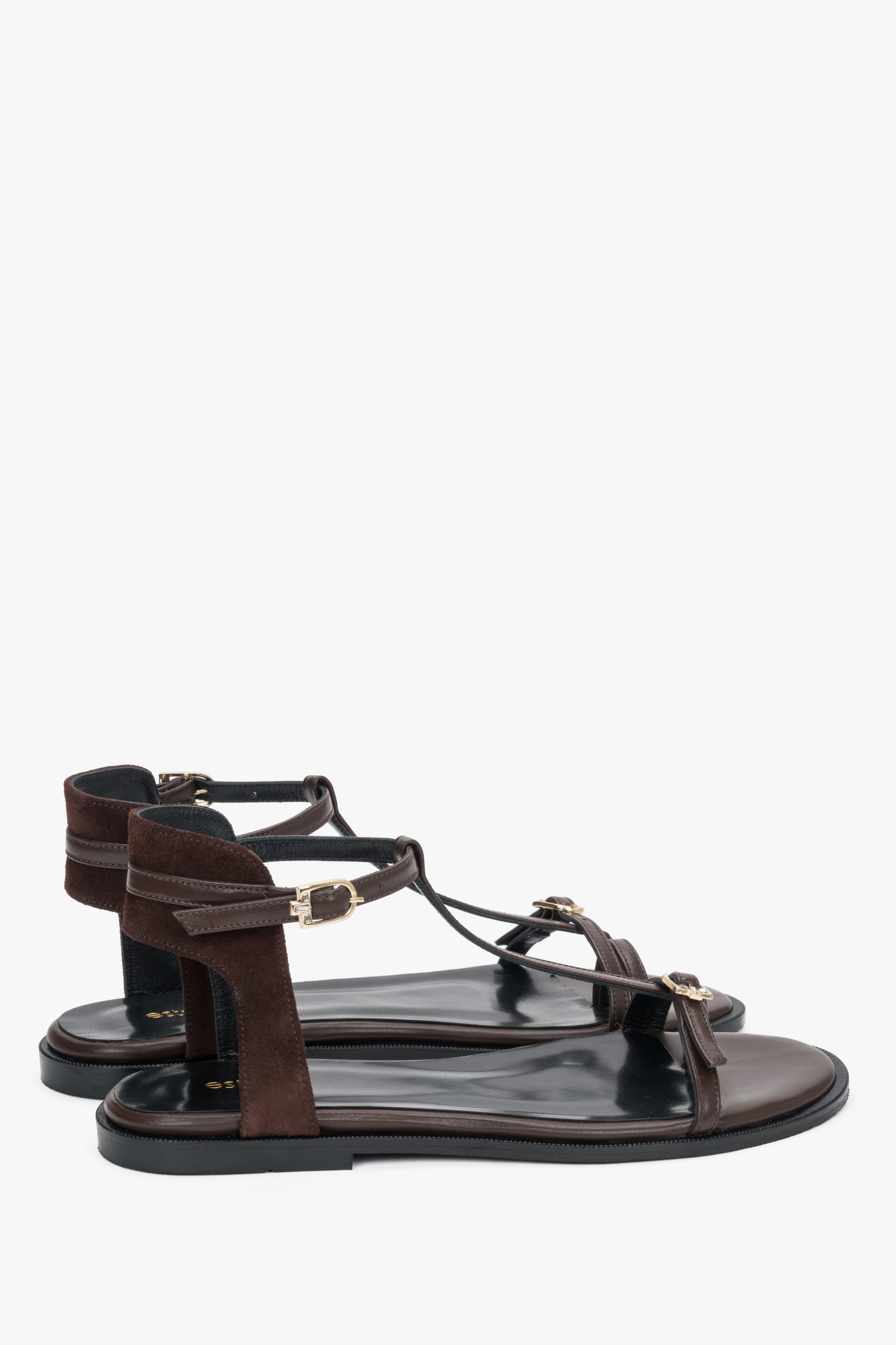 Angled view of women's dark brown sandals with flexible TPU sole