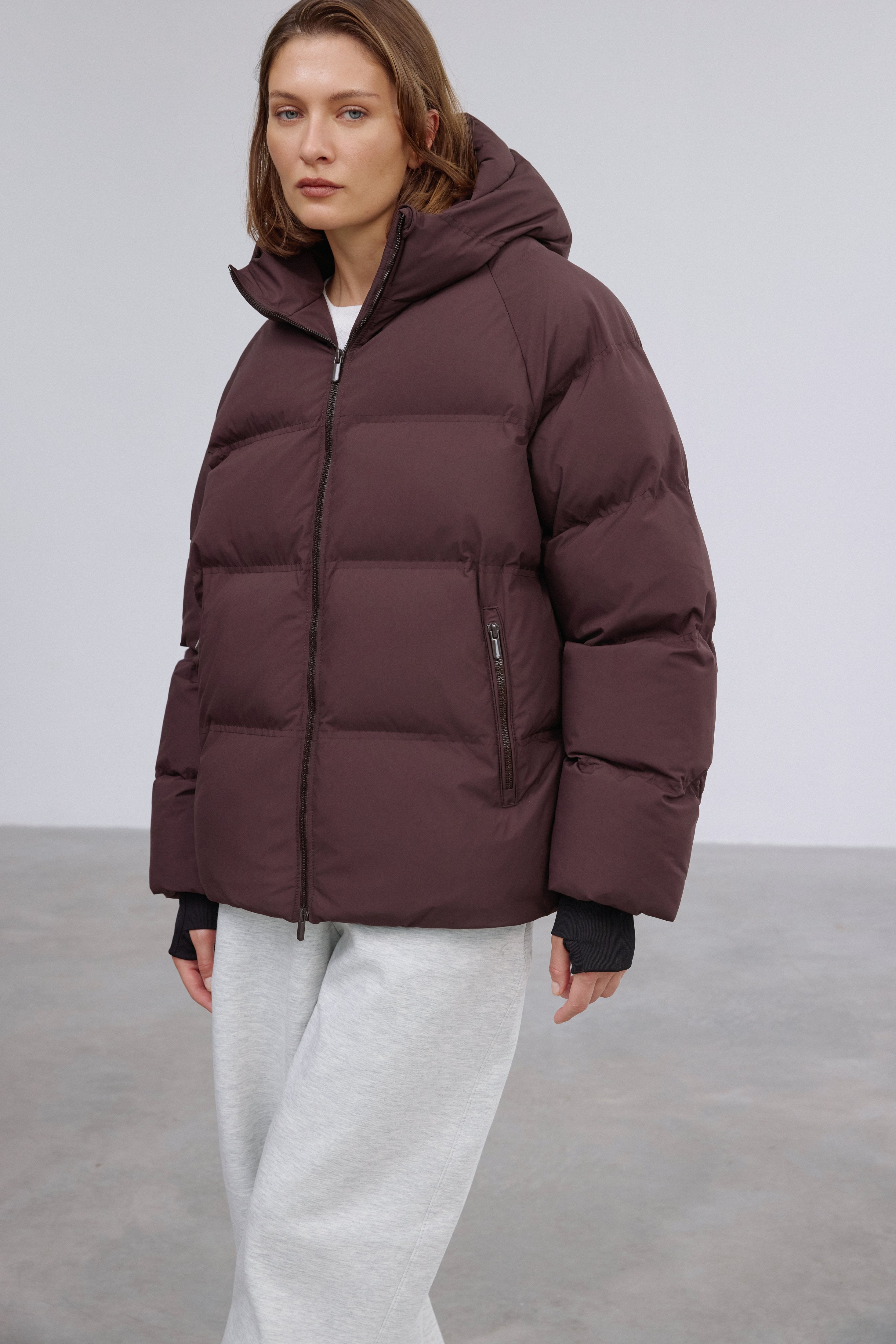 Front view showcasing the relaxed loose-fit silhouette and rich dark brown tone.