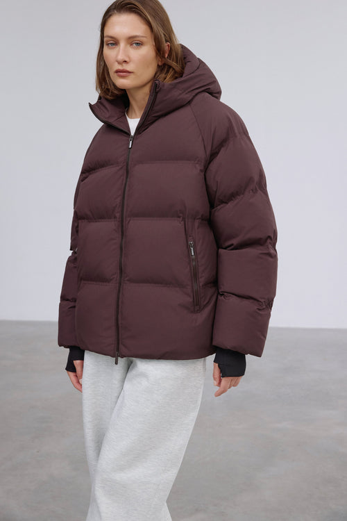 Front view showcasing the relaxed loose-fit silhouette and rich dark brown tone.