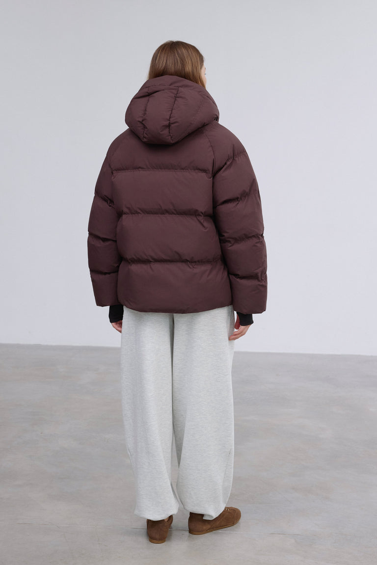 Full-length shot presenting the stylish loose-fit cut and minimalist design.